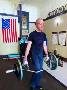 picture of Ken doing loaded carries at Eric Moss Fitness a personal training gym in Boonton