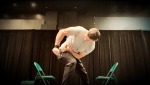 Eric Moss twisting open a horseshoe at a conference in Texas.